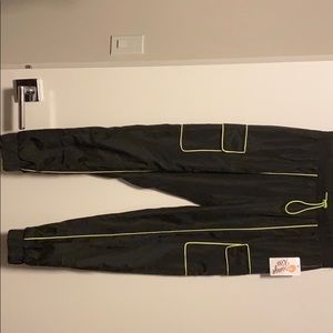 Black joggers with neon yellow green accents